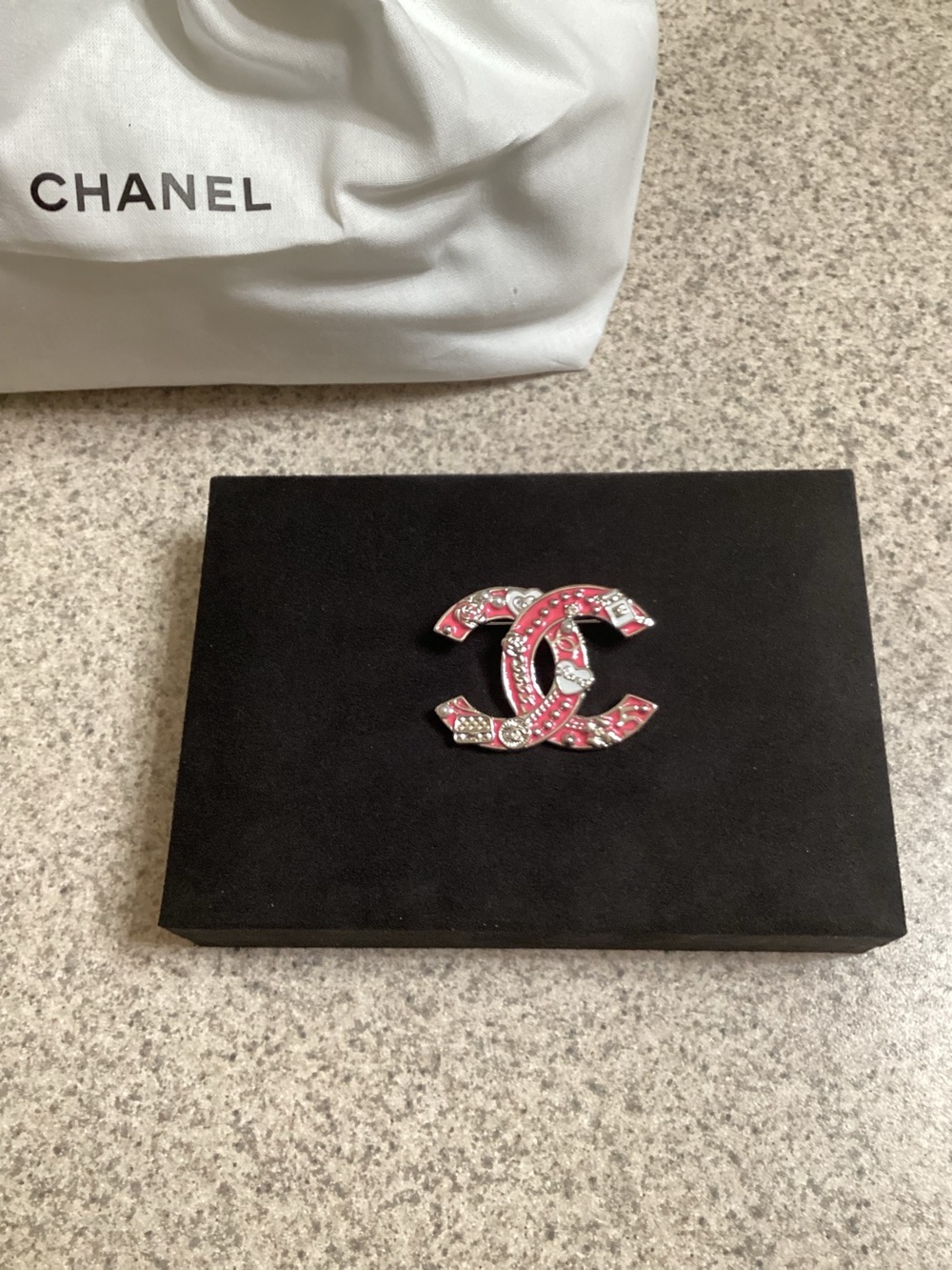 Chanel brooch.